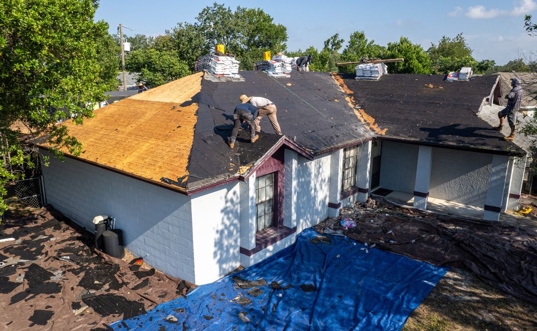 Damaged roof shingles showing wear and deterioration