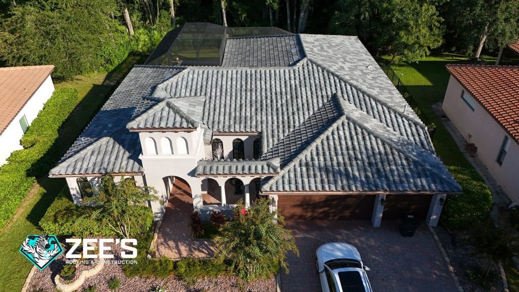 Wide shot of a residential roof being assessed for roof repair vs replacement by a licensed contractor