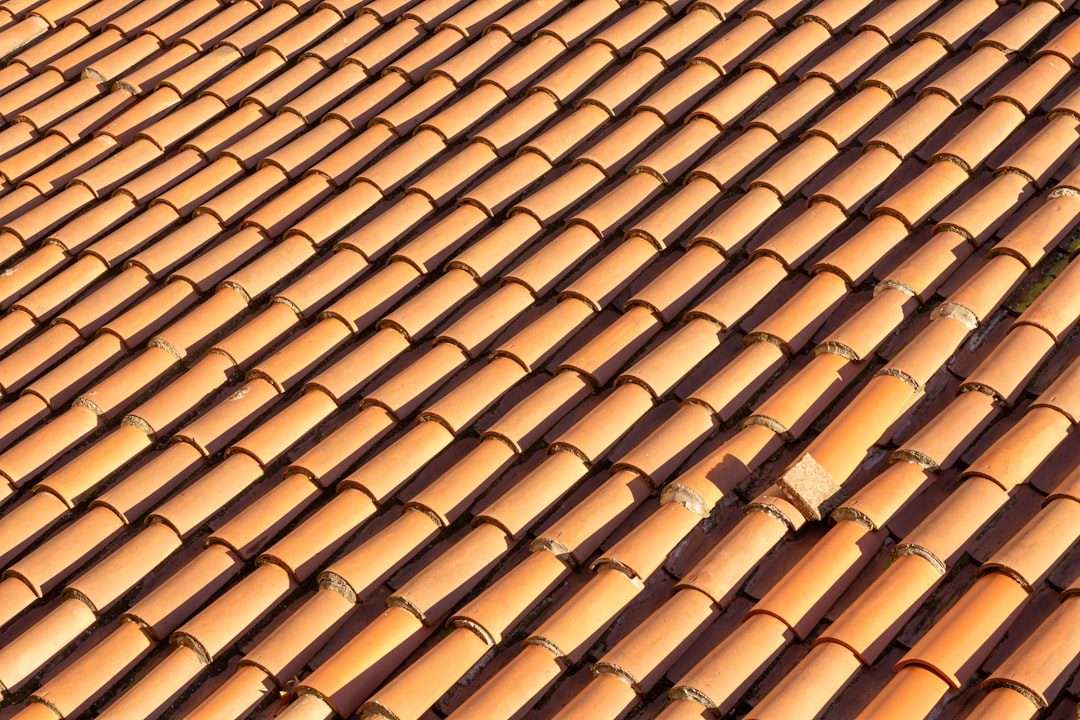 Close-up of shingle installation during a condo association roofing replacement